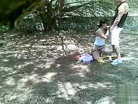 Doggystyle quickie under the shade of a tree