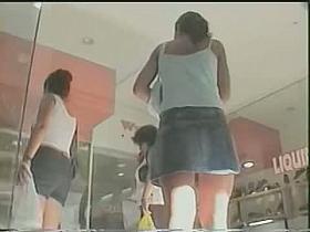 Gorgeous babe is jeans skirt is filmed in public