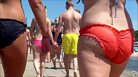 Big female booty in an orange bikini is breathtaking