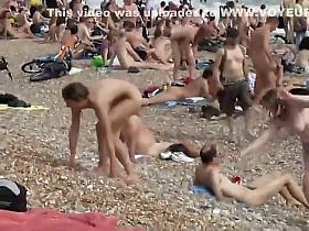 Pretty nudist girl steps out of the water