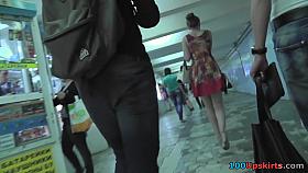 Slim redhead wears mini skirt in upskirt movie