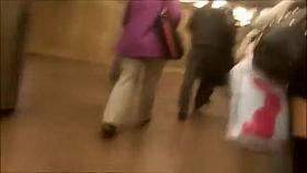 Woman in short black skirt and black socks upskirted