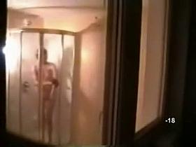 Hidden shower videos feature a sexy, moist blond girl.