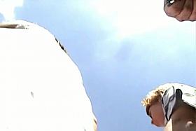 Bare pussy underskirt video of a woman in white