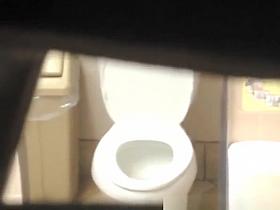 Brunette woman spied in public toilet pissing