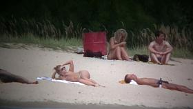 Busty blonde nude beach MILF spied on by a voyeur