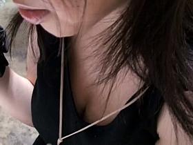 Gorgeous Asian babe surrenders a downblouse view of her tits