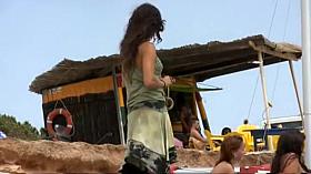 Hot girl undresses herself on a beach