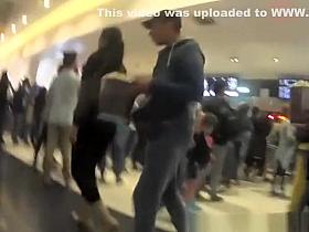 Girls in tight jeans pants at the shopping