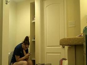 Chubby nerd girl in toilet