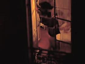 American tourist shaking her nude boobs in the hotel window