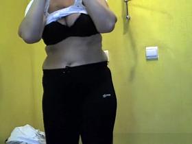 Short hair mature woman undressing and dressing