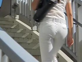Candid street shots of cute teen in tight white jeans
