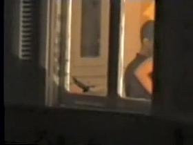 Man kissing the naked lover on window voyeur movie