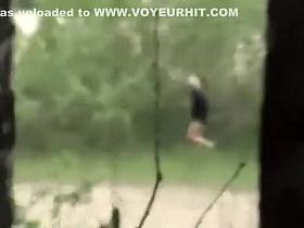 Zoom on a woman pee while other wait