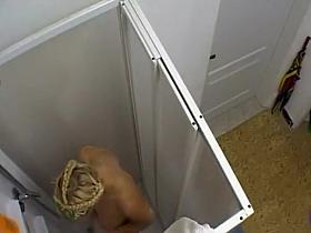 Spying blonde girl's shower orgasm