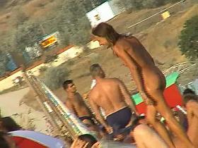Naked hotties showing their pussies at the beach