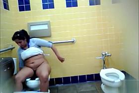 Thick Mexican woman piddles and washes her genitals in the restroom