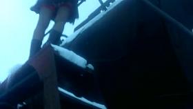 Girl in black stockings with a red tops on a steam train 2