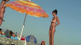 Sexy beach nudist women putting on lotion caught by spy cam