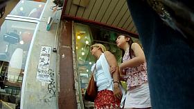 Hot sexy upskirt of beautiful blond girl walking with friend