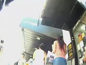 Trying to peep under a short blue skirt