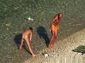 Nude woman swimming and drinking