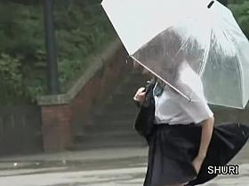 Asian schoolgirl gets street sharking on a rainy day.