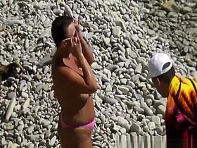 Nudist couple enjoying the fresh water