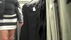 Curvy woman in a short skirt goes shopping