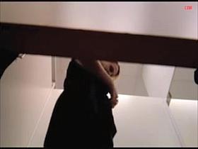 Low quality video with blonde trying on the new dress