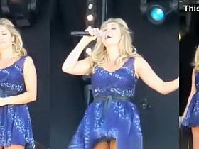 Wind lifts singer dress exposing her panties