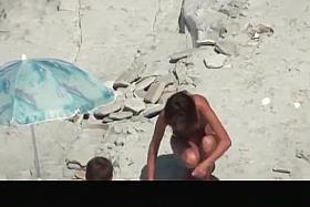 Nudist woman takes off her clothes