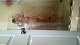 Husband films wife in shower