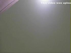 Pissing girl spied from above the wall