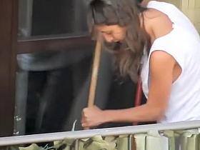 Woman cleaning the apartment tits downblouse