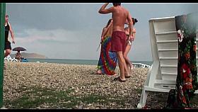 Voyeur on public beach. Girls posing