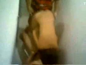 Two buddies share a girl in a toilet stall