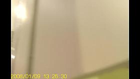 Girl in changing room admires her own reflection in mirror