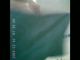 Hidden shower cam catches a brunette and her hairy pusy