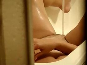 Spying as her legs spasm in an orgasm