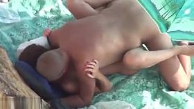 Outdoor voyeur with horny couple having sex on public beach