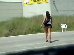 Hoe on the street in miniskirt flashing ass