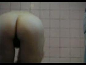 A Hairy pussy, nice ass and alright tits in a voyeur shower porno