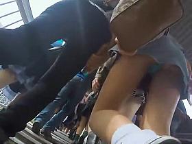 Sexy upskirt of a leggy young babe