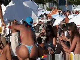 Hot brunette babe in bikini at beach