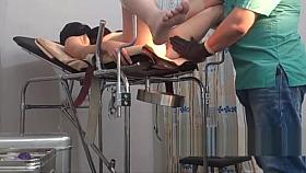 girl in a black mask. exam in gyno chair