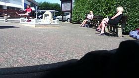 Blonde lady dangling her sandals