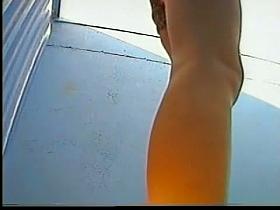 Beach changing room voyeur video with a fresh girl