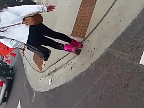 Teen in black leggings in the street